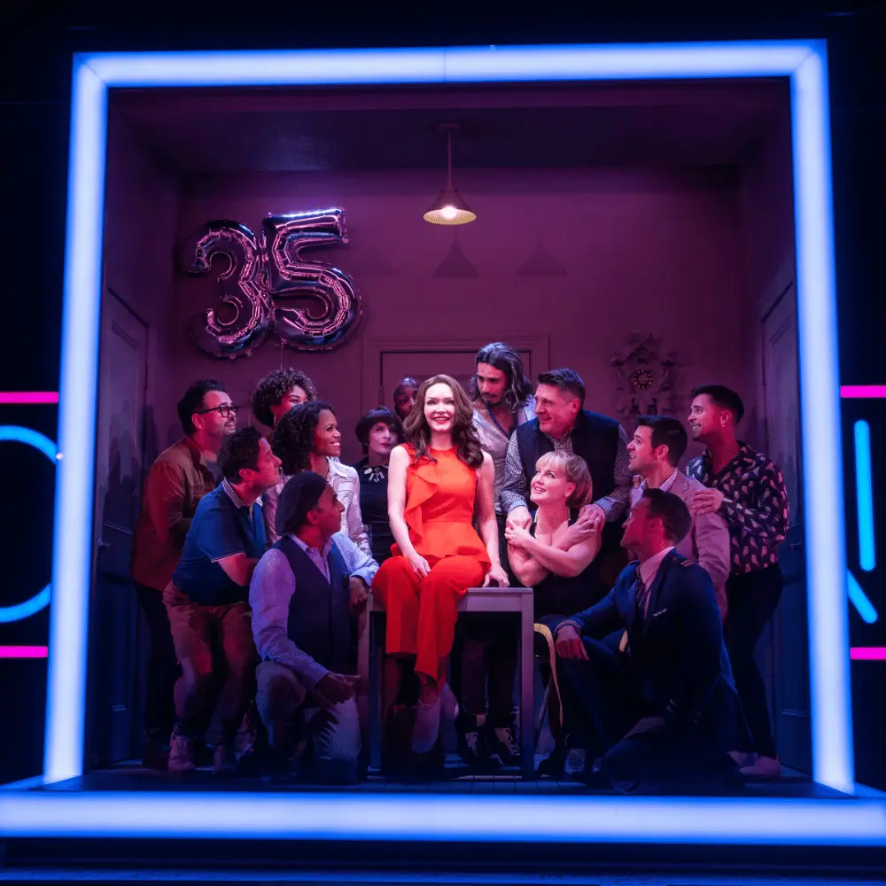 Broadway stage scene under dramatic lighting