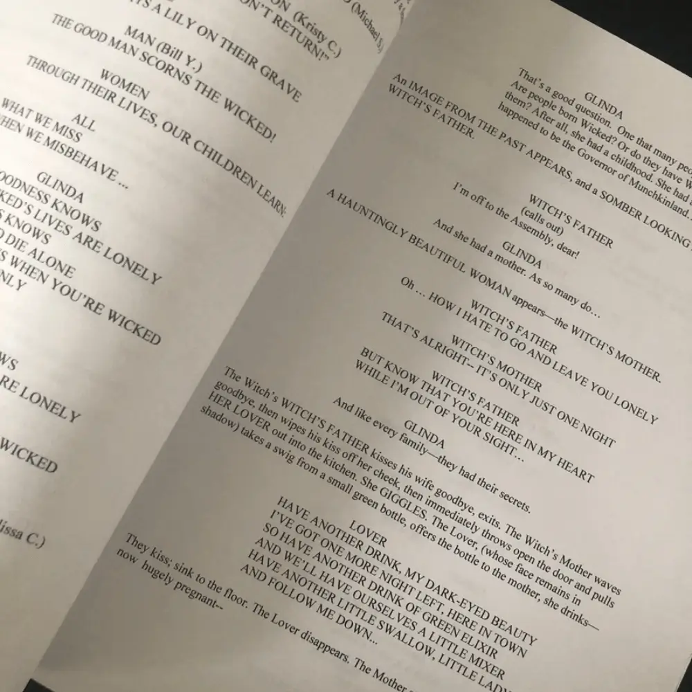 An open script showing lyrics and stage directions from a musical scene