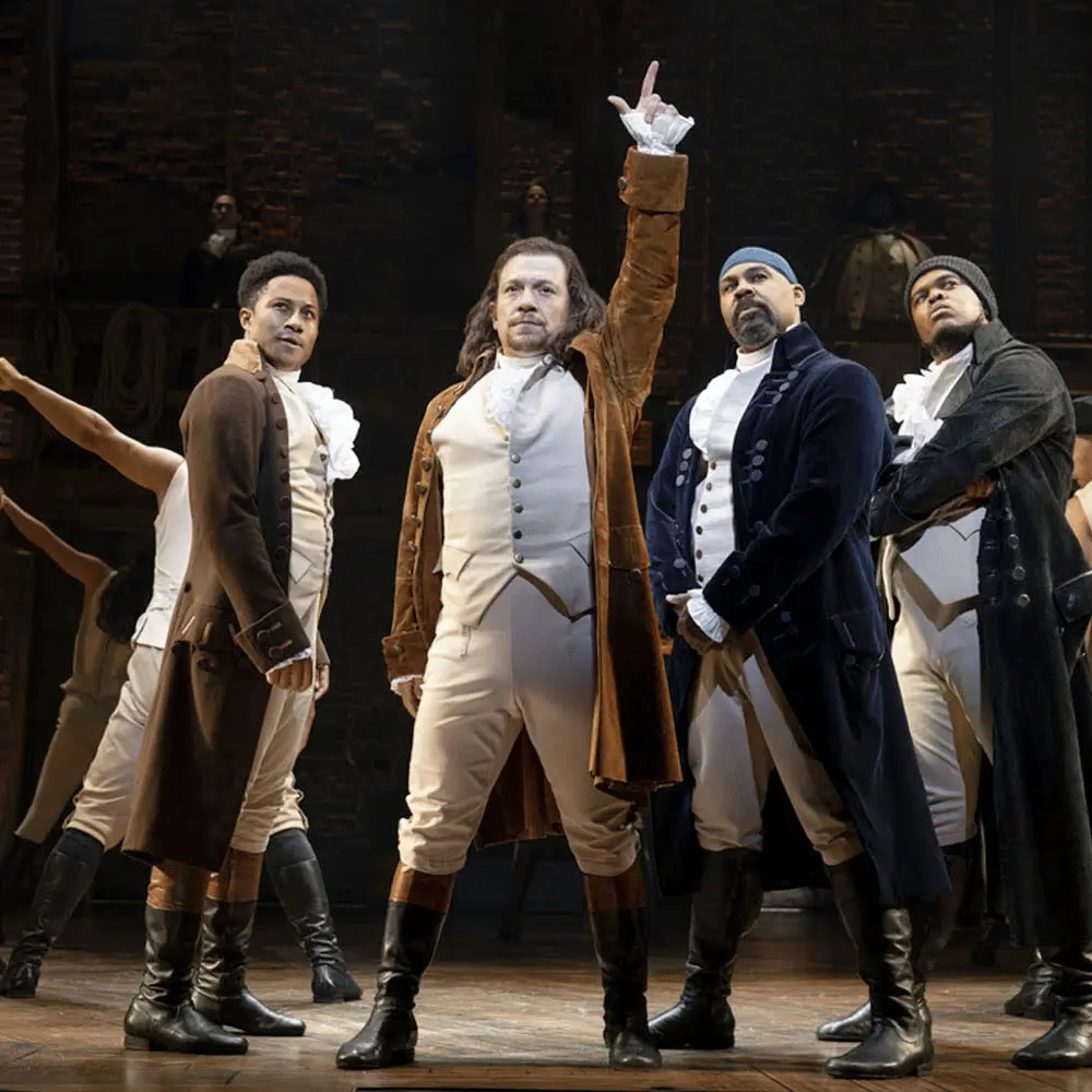 Broadway performers on stage during a live production
