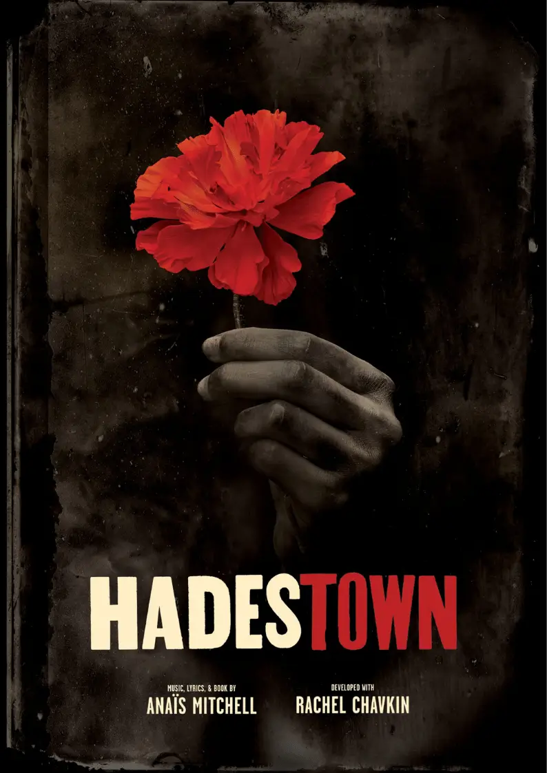 Poster for Hadestown showing a hand holding a red flower
